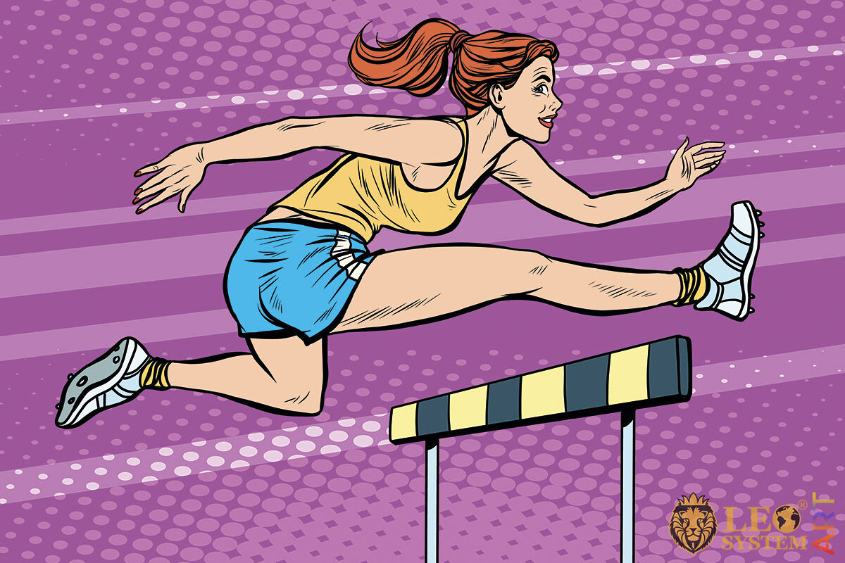 Picture of an athletic woman jumping over barriers