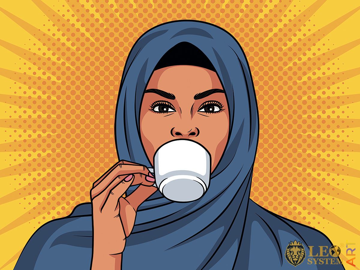 Picture of oriental woman drinking a cup of coffee