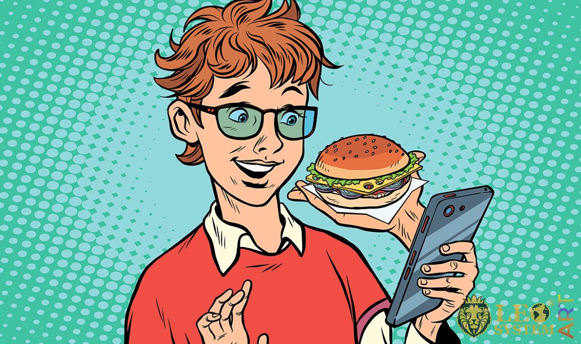 Picture of a cheerful child with a mobile phone